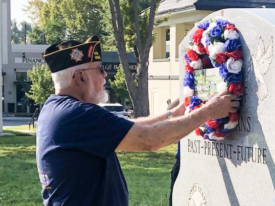 Post Trustee Ike Reeves placed the VFW Memorial Wreath on the Veterans Memorial marker honoring those who gave their lives during the Korean War and for those who served and have since passed. (Leon Aldridge photo/The Light and Champion)