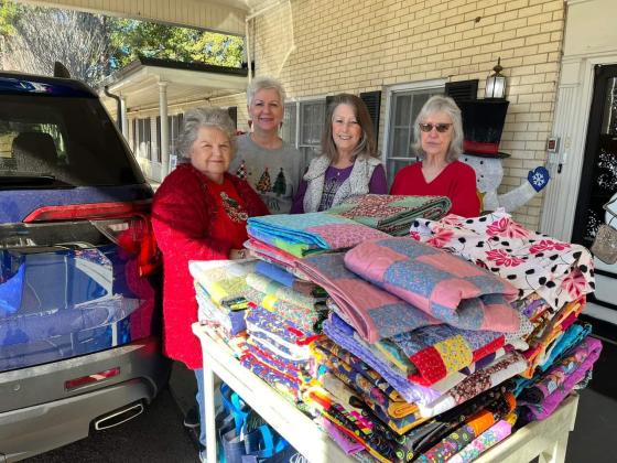 Scrap Happy Quilters bring quilts to Holiday Nursing residents