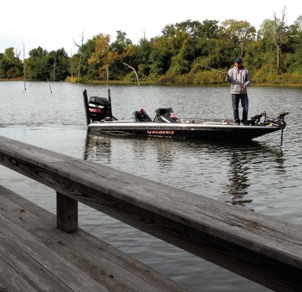 Pitching and sidearm roll casting are ideal for placing baits beneath boat docks or tight to targets like stumps, bushes or dock supports. (Photo by Matt Williams)