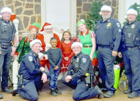 The Center Police Department’s “Cookies &amp; Cocoa with Santa” focused on giving back during the holidays drew a large crowd Sunday at the Community House. Shannon James photo/The Light and Champion