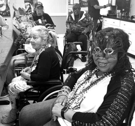 Focused Card celebrates with Mardi Gras decorations. Staff and residents were all smiles.