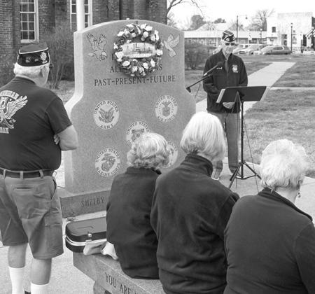 Shelby County VFW Post #8904 Post Quartermaster Larry Hume welcomes members, auxiliary and friends to remember the U.S.S. Maine and the Spanish-American War at a Thursday, Feb. 15 ceremony.