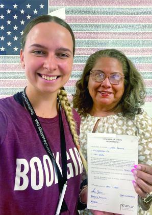 Linda posed for a photo with Center City Secretary Esther Elizondo after obtaining a vendor permit to sell door-to-door.