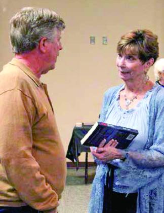 1. Seventeen local authors attended the Fannie Brown Booth Library’s Author’s Day to meet readers and sign books. 2. Event organizer and Center author and writer,Terri Lecher, talks with Shelby County native and book author Larry Enmon. (Leon Aldridge photos/The Light and Champion)
