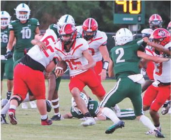 After catching a screen pass, Dylan Parker finds a seam in the Hemphill defense. (Photo by Taylor Bragg)