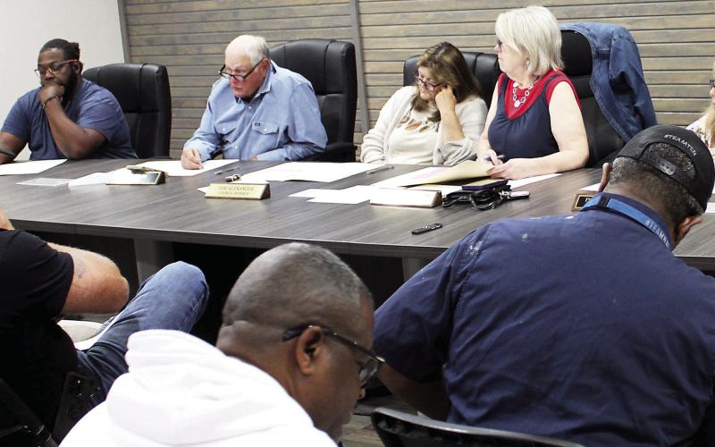 Timpson city mayor Debra Smith (center) leads discussion on the best method of cleaning up debris in city parks and right of ways. The council also considered raising the rental rates for its community building. Lisa White | Light and Champion