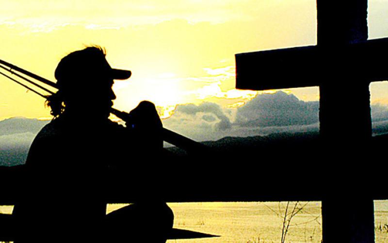 An angler pays tribute at a monument erected at Lake El Salto in Mexico in the memory of the late August “Tigre” Hansch. Hansch was a regular who died in 1997. Photo by Matt Williams