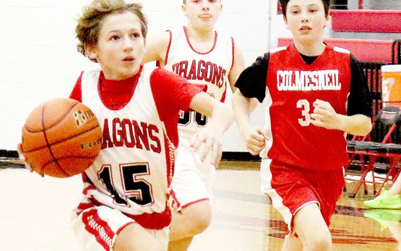 Peyton Jacobs drives upcourt against Colmesneil in the Shelbyville 7th grade boys game. Shelbyville won the game 41-7.
