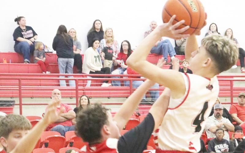 Bryce Ebernez takes a shot in the Shelbyville 8th grade boys game against Colmesneil. The Dragons came out on top 66-23.