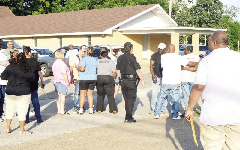 Tenaha Mayor O’Neal Jones (right) was confronted by angry residents after a Tenaha city council meeting Monday evening which saw Police Chief Jake Metcalf dismissed from his position. David Danley | Light and Champion