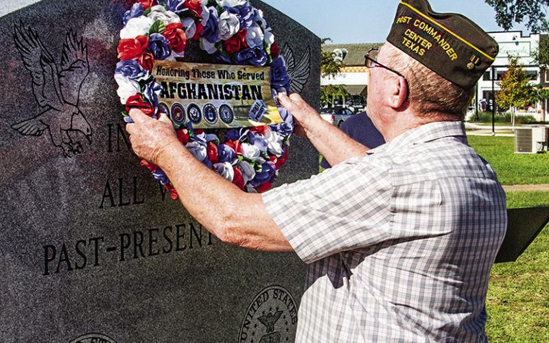 Past Post Commander Mike Langford places the memorial wreath at Monday’s Operation Enduring Freedom remembrance.