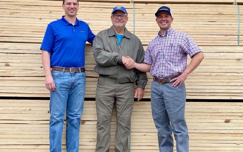 TBLA President Gary Moore thanks Joshua Garcie (left) and Kyle Martinez (right) of Interstate Building Materials for their generous donation of the materials required to build this year’s custom-built Greenhouse.