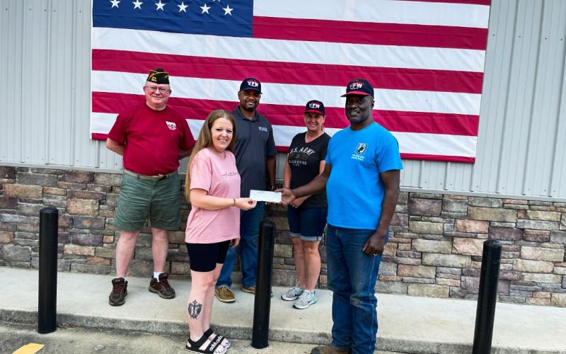 Pineywoods Beverage presents donation to VFW Post 8904