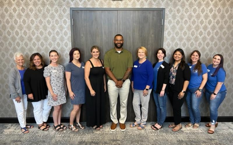 Shelby County Children's Advocacy Center staff smile for a photo with guest speaker Gaelin Elmore after Tuesday's presentation. (Submitted photo)
