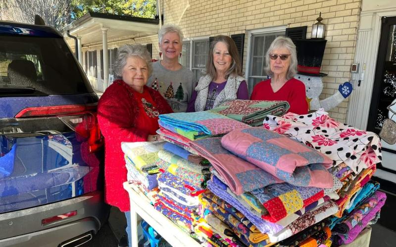 Scrap Happy Quilters bring quilts to Holiday Nursing residents