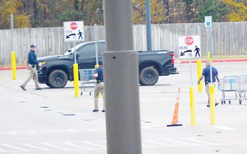 Center Police Department personnel work the scene of a bomb threat at Center’s Walmart store. A call was received by the department that a bomb had been placed at the location. The store was immediately evacuated and the building secured. David Danley | Light and Champion
