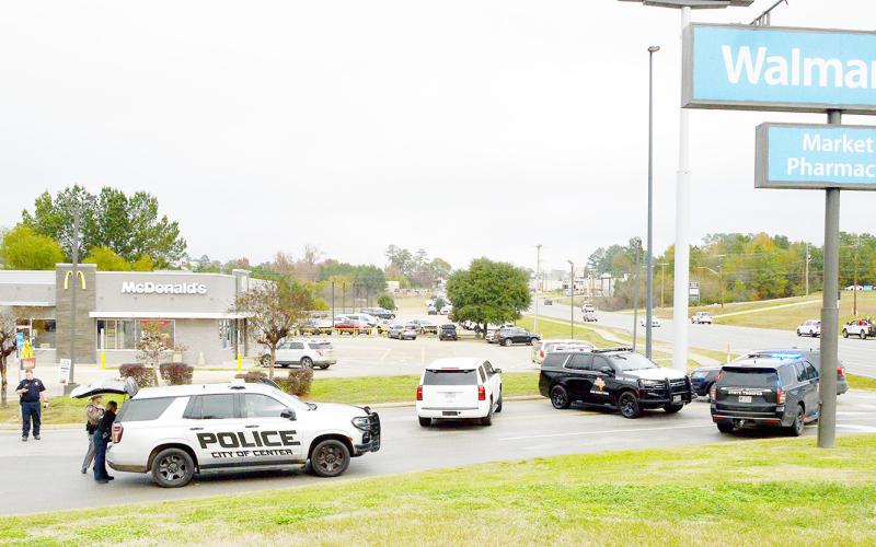 Officers with the Center Police Department and DPS troopers blockade the main entrance to the Center Walmart store due to a bomb threat received early in the morning on Thursday, Dec. 18. David Danley | Light and Champion