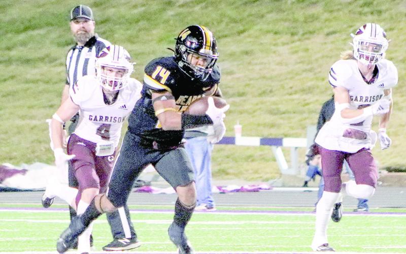 Bears’ receiver Tyler Lane looks for more yardage down the field after snagging a pass from quarterback Terry Bussey. (Photo by Taylor Bragg)
