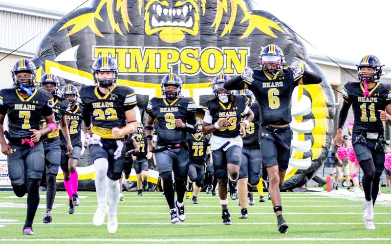 The Timpson Bears charge out of the tunnel ready to rumble before their game against the Hooks Hornets. TISD Student Media Intern Savannah Cassell |Light and Champion
