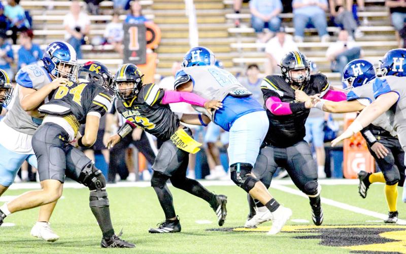 Bears and Hornets swirl around each other as they try to maneuver themselves into position to make a play during Timpson and Overton’s face-off last Friday night. TISD Student Media Intern Savannah Cassell |Light and Champion
