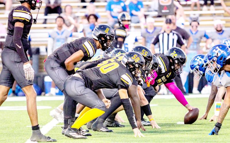 The Bear offense lines up ready to run a play against the Hooks Hornets. TISD Student Media Intern Savannah Cassell |Light and Champion