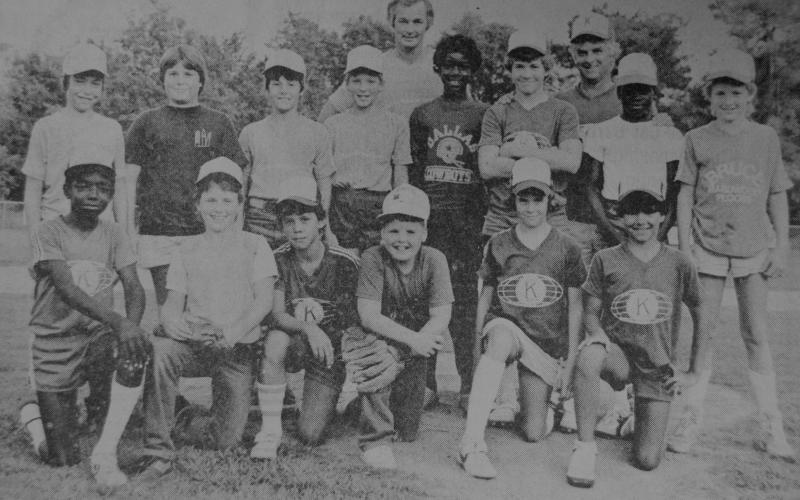 A-Ball All Stars: Representing Center are: (left to right front) Wayne Bennett, Jason Snider, Joel Porter, Jody Matthews, Brandon Bennett and Vic Cooper, Jr. Back row are: Chad Burrows, Jason Cummings, Michael Dawson, Brandon Hardy, Devon Hubbard, Brent Hughes, Keith McCoy and Josh Payne. Standing behind the boys are their coaches Kenneth Hardy and Vic Cooper, Sr.