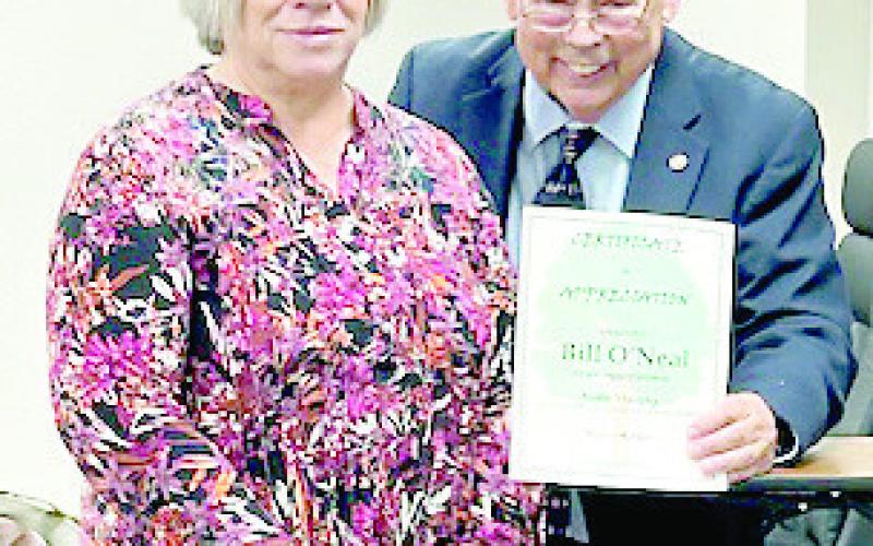 Kathy Grisby presents a certificate of appreciation to Bill O’Neal for his presentation on Audie Murphy at the Timpson Area Genealogical and Historiacl Society March meeting. Submitted | Light and Champion