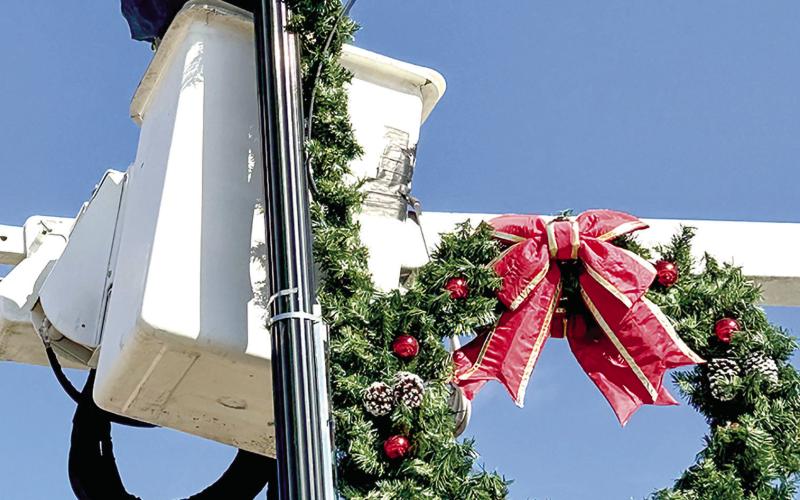City workers were busy this week decorating the downtown Center square for Christmas. Center’s Christmas parade is Saturday night. Leon Aldridge photo/The Light and Champion