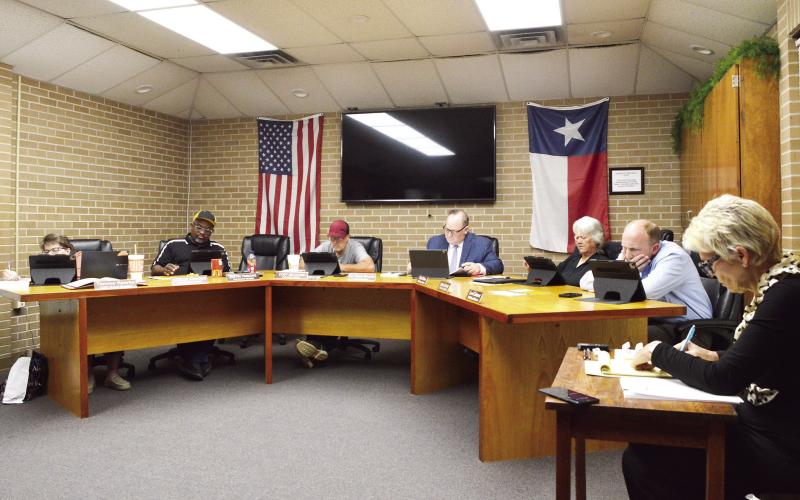The Timpson ISD board of trustees reviews the monthly nancial report at its April meeting. David Danley | Light and Champion