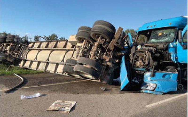 The JVFD assisted with emergency services at a two tractor-trailer accident Sunday on the Haslam Strip. One of the rigs was on its side partially in a saltwater disposal driveway and the other was still in the roadway. Both drivers were transported to separate hospitals for treatment of injuries. (Submitted photos)