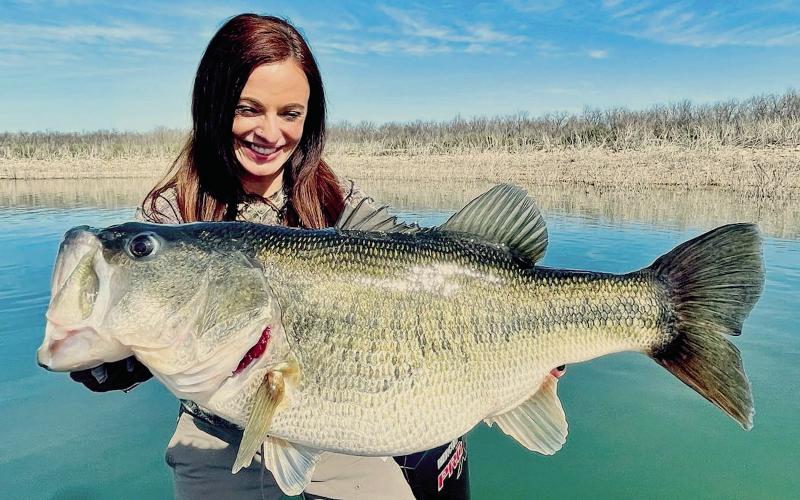 Lady angler Lea Anne Powell of Lake Jackson displays the 12- pound, 3-ounce bass she caught in February at Lake O.H. Ivie. Powell, who caught the fish on spinning rod, has submitted an application to the International Game Fish Association to have the fish certified as a 12-pound line class world record. (Courtesy Photo/Dalton Smith)