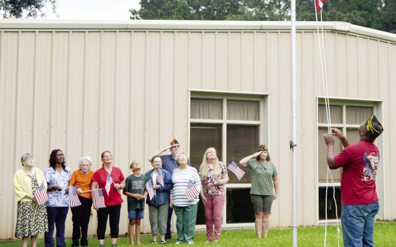 Members of VFW Post 8904 visited the Shelby County Outreach Ministries Senior Nutrition Site on Friday to donate a new flag in observance of Flag Day. Flag Day was established to commemorate the adoption of the American flag by the Second Continental Congress in 1777. David Danley | Light and Champion