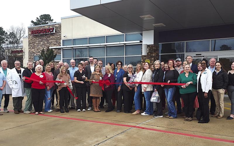 Staff of the NMC Shelby County Emergency Services and Diagnostic Imaging Center, along with the Shelby County Chamber of Commerce and other well-wishers celebrate a ribbon cutting for the facility. David Danley | Light and Champion