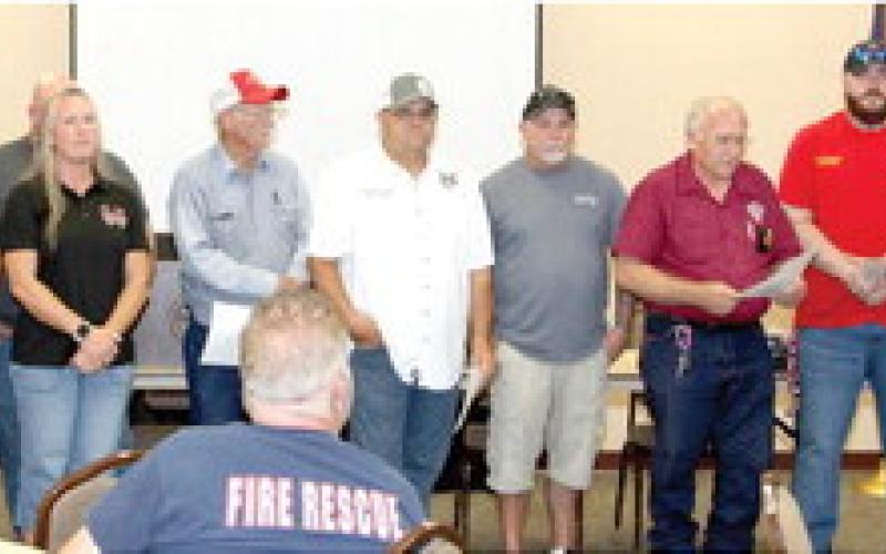 Also presenting donations was the event host, the Rotary Club of Center. Club President Steve Waters (far right) thanked all the organizations that joining to benefit the fire departments. Waters presented each department with a donation of $505 from the Rotary Club of Center.