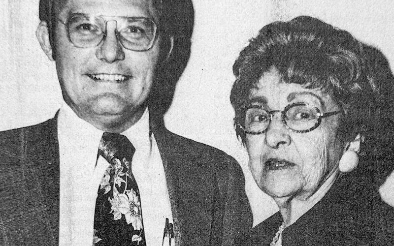 NEW DIRECTOR — Mrs. Rex Payne, well-known Center merchant and newscaster, is shown with Joe Mihatsch, president of First National Bank in Center. Mihatsch is announcing Mrs. Payne’s election to the bank’s board of directors. He said, “The bank is fortunate in adding Mrs. Payne’s services and talents to our board.” Mihatsch added, ‘’Her election is evidence of the bank’s interest in having women involved in the daily affairs of the bank.” Champion Photo