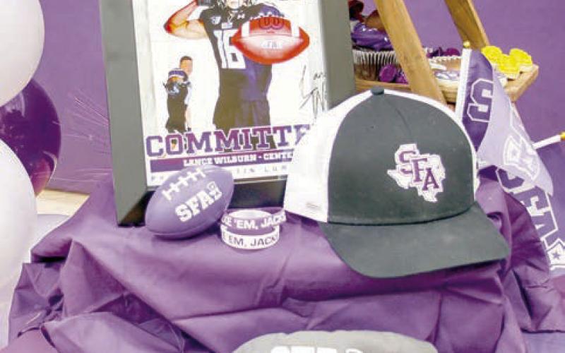 Center wide receiver and free safety Lance Wilburn’s photo display at the CISD signing ceremony Wednesday. Wilburn will play football for Stephen F. Austin State University.
