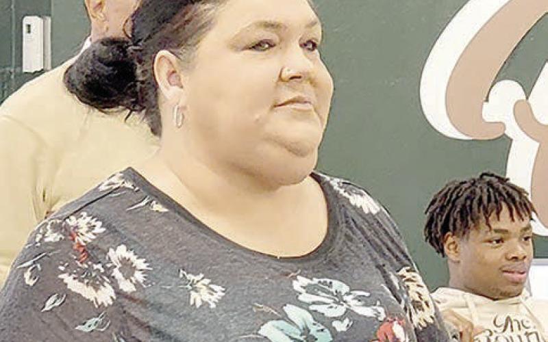 Veronica Davis of the Light and Champion who just loves it when her picture gets taken enjoys her first college signing day at Timpson ISD this past Wednesday.