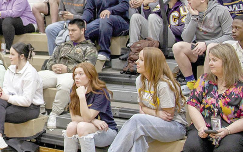 Family, friends, and team mates watched as Keden Dixon and Lance Wilburn signed letters of intent to play college football Wednesday at the Center High School gymnasium.