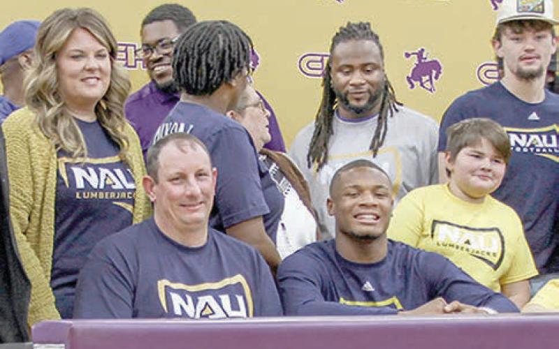 CISD athlete Kaden Dixon posed with family, friends and teammates at the letter of intent signing ceremony. Dixon will play for Northern Arizona University.