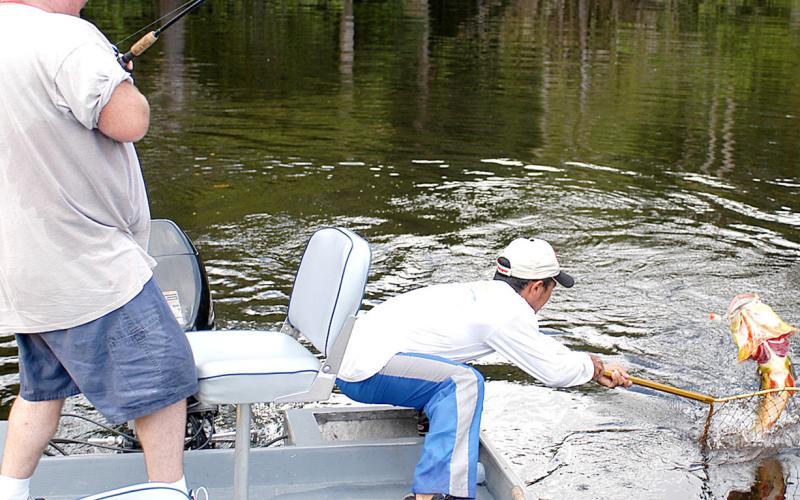 The late Kirk Wolfe battles a solid peacock bass on the Unini River, a tributary of the Amazon River in Brazil. A trip to the Amazon is one that every bass angler should experience at least once in a lifetime. Photo by Matt Williams