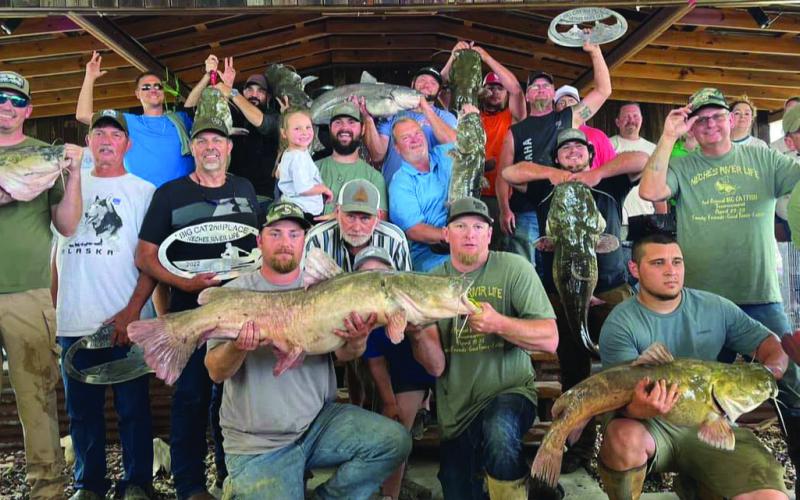 Catfishermen gather on the weigh-in stage during the 2022 Neches River Life event, where $$4,500 was awarded to the winners.This year's event is set for April 14-15. (Photo Courtesy, David Holland)