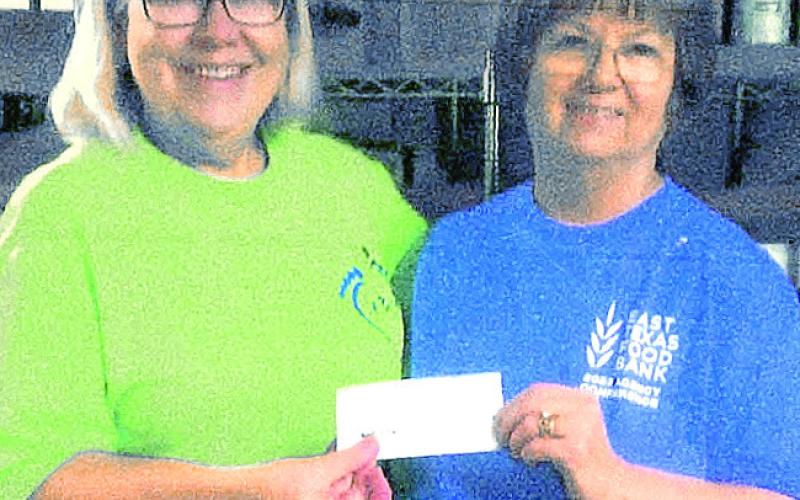 Mayor Debra Smith was presented check for Food For Thought from Molly Campbell.