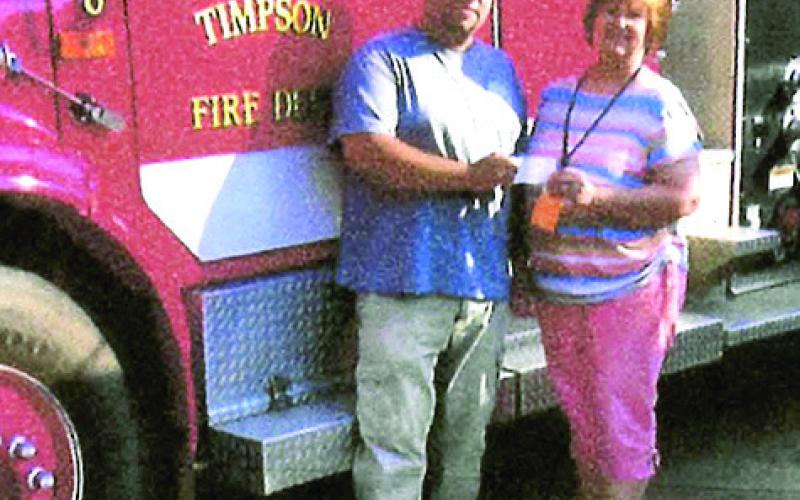 Tony Acosta received a check for the Timpson Volunteer Fire Department.