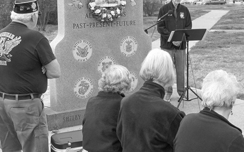 Shelby County VFW Post #8904 Post Quartermaster Larry Hume welcomes members, auxiliary and friends to remember the U.S.S. Maine and the Spanish-American War at a Thursday, Feb. 15 ceremony.