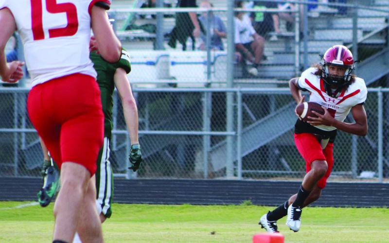 Junior Geechi Mathis takes a reception to the house in action earlier this season. Friday Mathis made the most of his one reception by taking it 23 yards and crossing the goal line. (Photo by Taylor Bragg)
