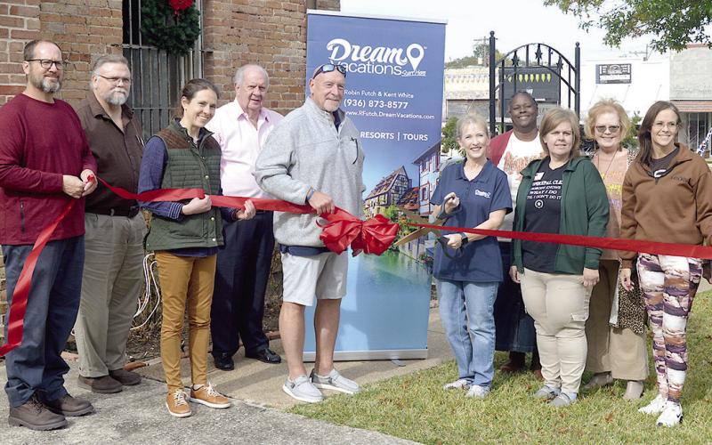 The Shelby County Chamber of Commerce Ambassadors welcome Dream Vacations agents Kent White (center, left) and his wife Robin Futch (center, right), to the Chamber. Zack Clark | Light and Champion