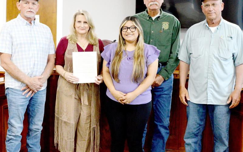 Lizzet Mendoza of the Family Crisis Center of East Texas (center) joined commissioners (from left) Shannon Metcalf, Tom Bellmyer and Stevie Smith and County Judge Allison Harbison to declare October Domestic Violence Awareness Month in Shelby County. Zack Clark | Light and Champion