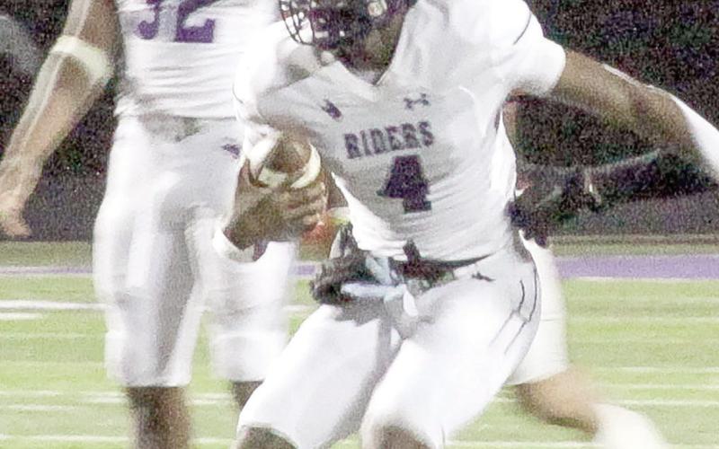 Emonte “Cash” Cross looks for a way out of the pocket. Cross ended his career as the leader in career passing yards and passing touchdowns. Leon Aldridge | The Light and Champion