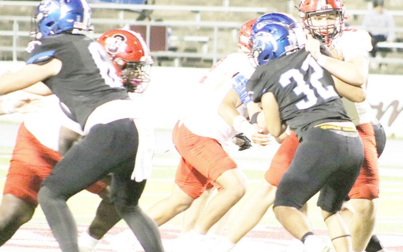 Members of Shelbyville’s offensive line struggle with Leon’s defensive front in an effort to control the line of scrimmage. Dragon Yearbook | Light and Champion