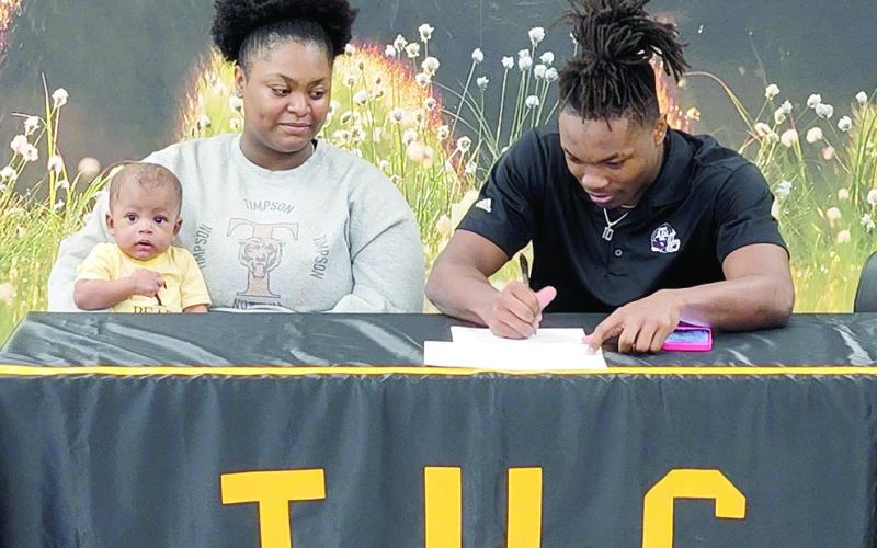 Several county athletes including Terry Bussey, Kaden Dixon and Lance Wilburn sign letters of intent to play college football.